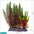 An artificial plastic aquarium plant decoration featuring a variety of colors including green, red, and yellow, with a textured base.